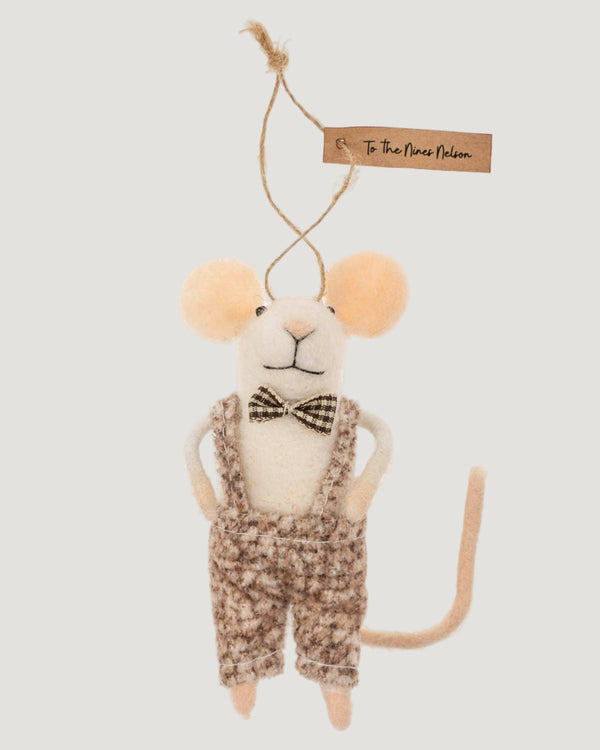 Stuffed mouse toy with a bow tie and overalls on a white background